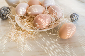 Natural easter eggs on table in the farm. Easter. Farm products. Eco-friendly products
