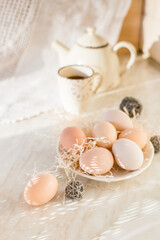 Fototapeta na wymiar Natural easter eggs on table in the farm. Easter. Farm products. Eco-friendly products 