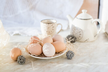 Fototapeta na wymiar Natural easter eggs on table in the farm. Easter. Farm products. Eco-friendly products 