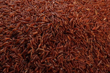 raw red rice background. uncooked brown wild rice, top view
