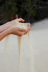 Two hands with sand in the desert