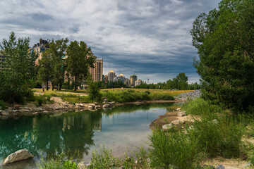 Fototapeta na wymiar view of Bow river floing inside Calgary, Alberta, Canada