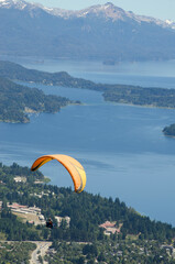extreme sport, paragliding flying landscape city of bariloche, lake nahuel huapi and mountains