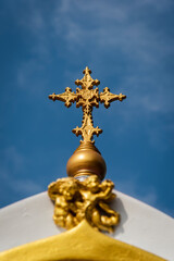 the golden cross on top 