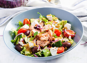 Ketogenic lunch. Greek salad with grilled salmon. Healthy dinner. Keto, paleo diet.