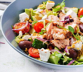 Ketogenic lunch. Greek salad with grilled salmon. Healthy dinner. Keto, paleo diet.