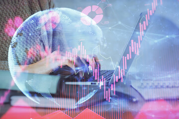 Double exposure of woman hands typing on computer and business theme hologram drawing. Success...