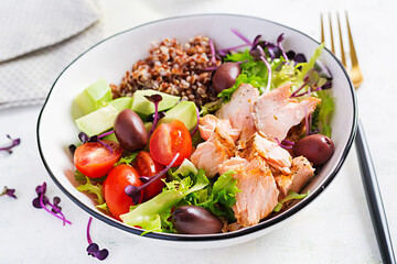 Salmon salad. Fresh salad with grilled salmon, avocado, cherry tomatoes, lettuce, quinoa, olive and microgreens. Homemade food. Concept healthy meal