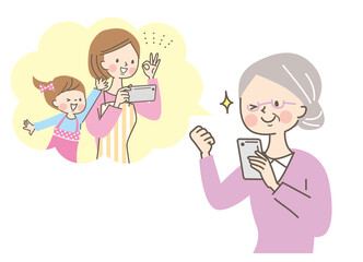 スマホで通話するシニア女性と娘と孫