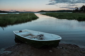 Naklejka na ściany i meble Moored boat on the shores of Lake Ladoga
