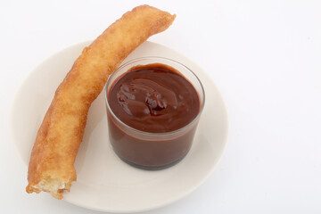 fried sugar bars with hot chocolate as typical spanish snack