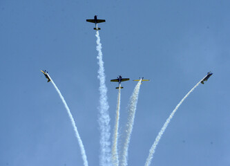 Formation of planes of the blue cloudy sky during the airshow.