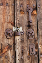 Old wooden door with a padlock