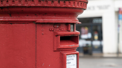 Side view of red post box
