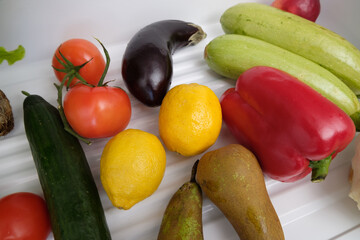 Frozen food in the refrigerator. Vegetables on the freezer shelves. Stocks of meal for the winter..