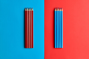 red pencils on a blue background blue pencils on a red background