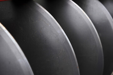 Cast iron discs used as raw material for making grills.