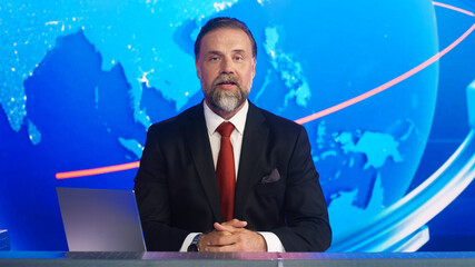 Live News Studio with Professional Male Newscaster Reporting on the Events of the Day. Broadcasting...