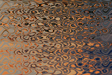 Abstract zigzag pattern with waves in orange, gray and black tones. Artistic image processing...