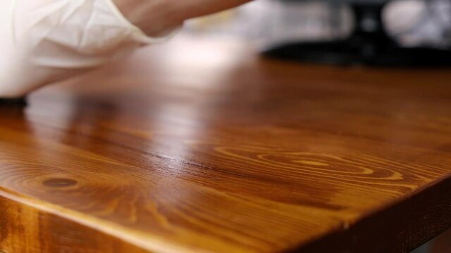 covering the wooden table with protective oil wax