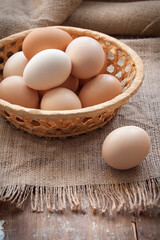Organic eggs in the basket on the cloth
