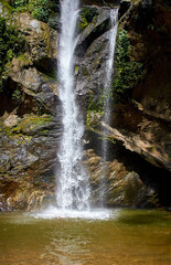 Fototapeta na wymiar A waterfall in the jungle of northern Thailand. Chiang Mai province. Mork Fa Water Fall.