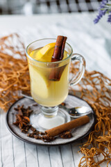 grog with cinnamon apple and lemon on a light background