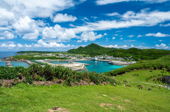Kubura port with its transparent waters sorrounded by green vegetation seeing from the westermost point of Japan. Yonaguni Island.