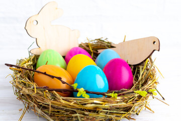 happy easter easter eggs in the nest with bunny decoration