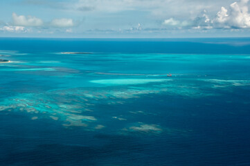 Exceptional view of coral reefs with its clear blue and green waters seen from the plane