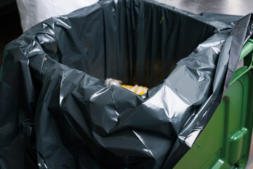 Close up photo of trash bin in kitchen.