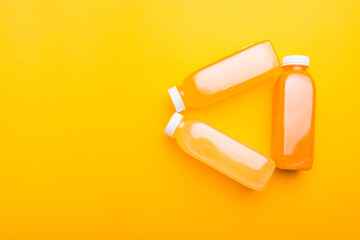 Photo of fresh detox juice bottles from orange lemon with vitamins.