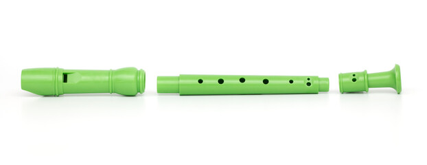 Green block flute isolated on white background © Emre
