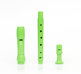 Green block flute isolated on white background © Emre