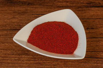 Dry paprika powder in the bowl