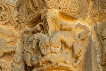 lions devouring a goat, Church of Santiago de Agüero, Agüero, Huesca, Spain