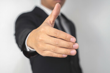 Modern businessman. A man in a business suit showing thumb up isolated on white background, with clipping path. Confidential Businessman Concept portriat.