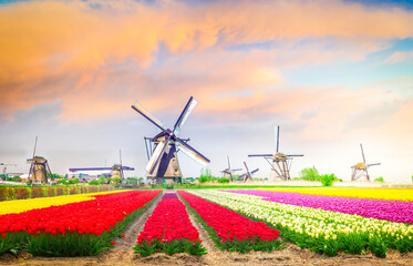 dutch windmill over river waters