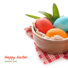 Colorful Easter Eggs in the bowl on the white background