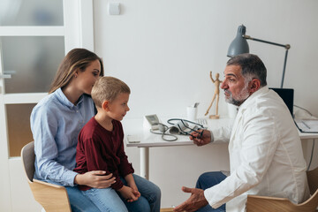 young boy with his mother visit pediatrician