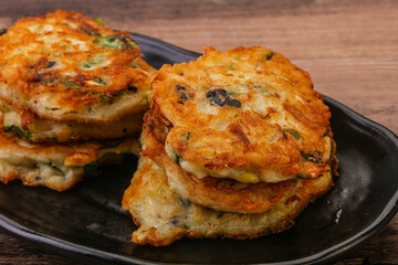 Zucchini pancakes with herbs and spices