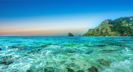 Fototapeta na wymiar Clear water and blue sky. Sea beach in Krabi province Thailand.