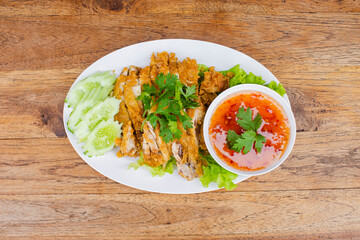 Fried chicken pieces on a plate with dipping sauce