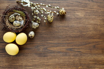 easter composition with painted eggs on a wooden surface with a copy of the space