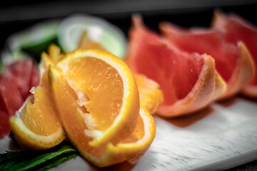 Closeup orange and red grapefruit slices breakfast tropical snack photo