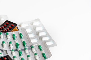 Colorful antibiotic drug capsule pills in blister package.