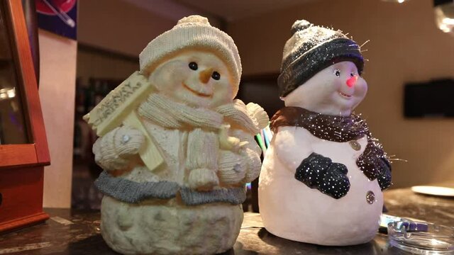 New Year's attributes. Snowman statue. Two snowman statues