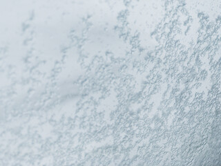 Close Up Winter Ice and Snow Sticking to Glass Window