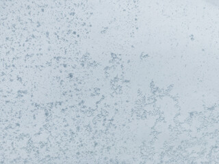Close Up Winter Ice and Snow Sticking to Glass Window