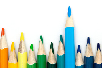 Organized colorful wooden pencils, isolated on the white background. Copy space.